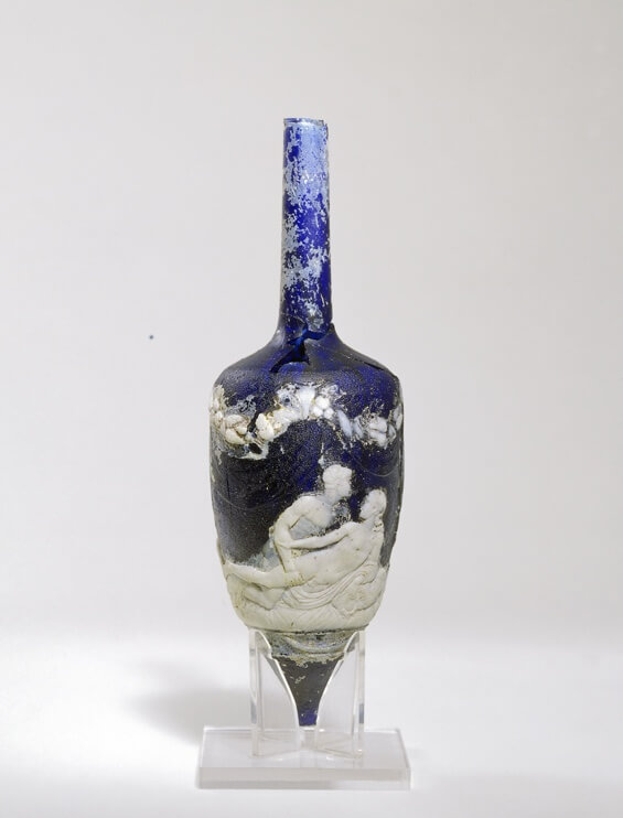 An ancient blue glass perfume bottle with white cameo decoration
